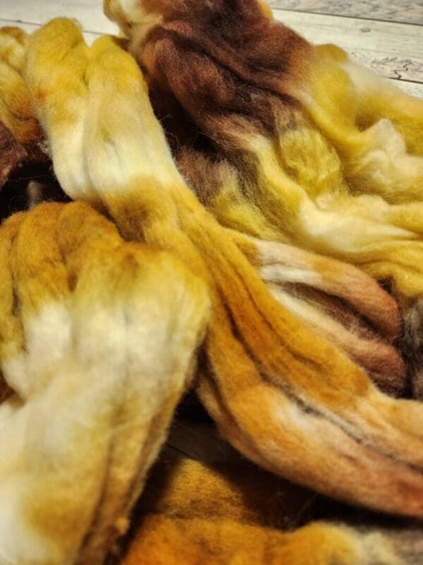 A pile of brown and yellow fibers on a table.