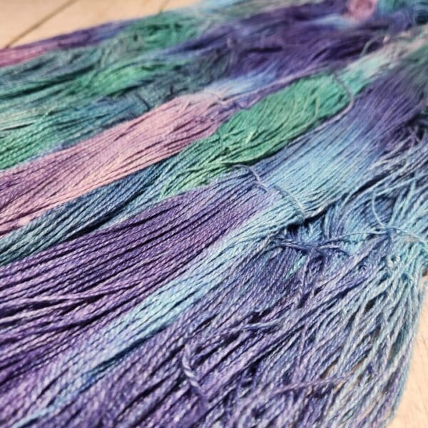 A close up of some purple and blue dyed yarn.