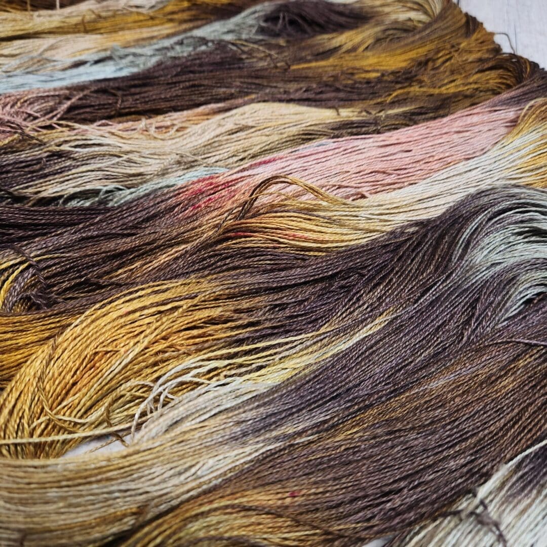 A skein of yarn in a variety of colors.
