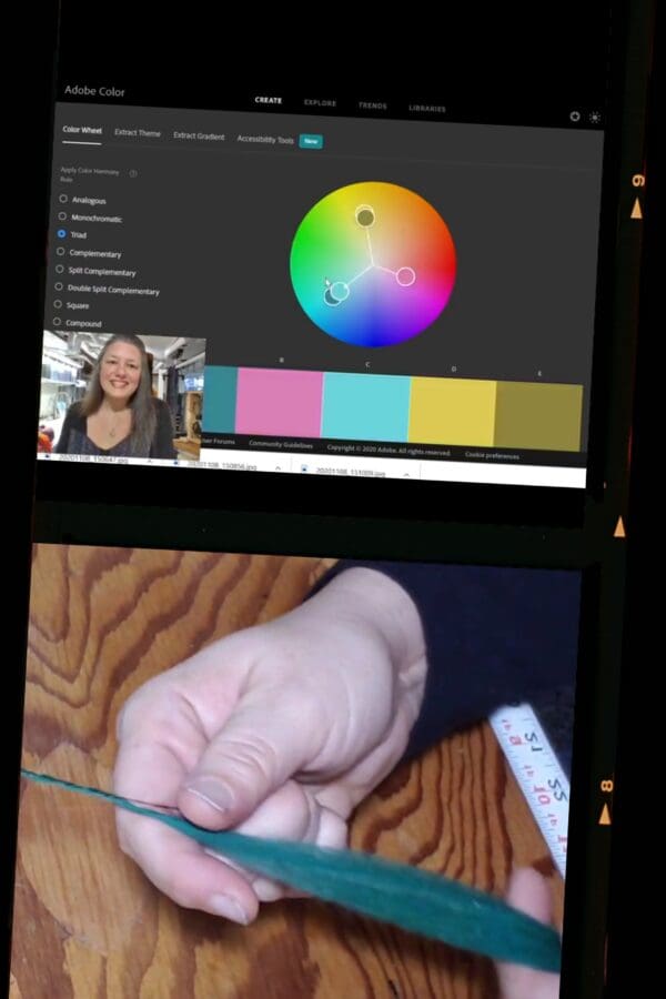 A screen shot of a computer screen showing a person cutting a piece of paper, with the focus on the hand.