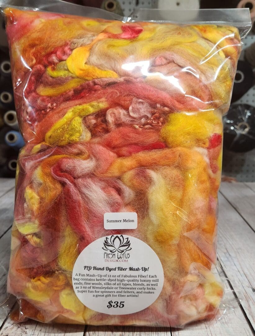 A bag of yellow, orange, and red felt.