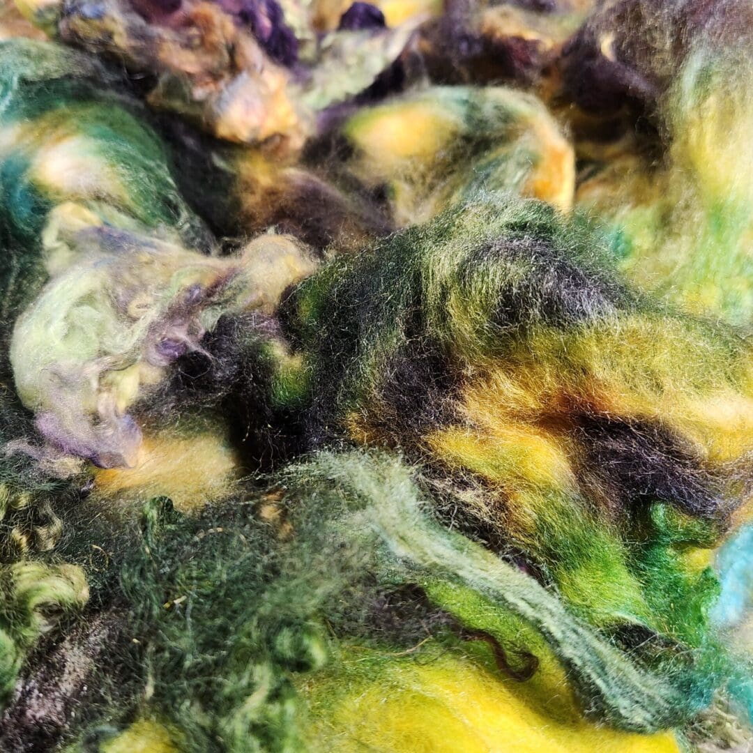 Close-up of green, yellow, and black wool.
